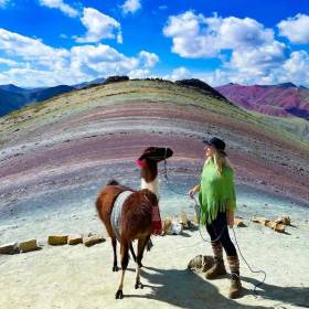 Palcoyo Photos - Photo of a Tourist with a Llama on Rainbow Mountain